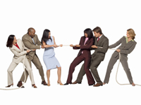 Six people, three on either side, playing tug of war